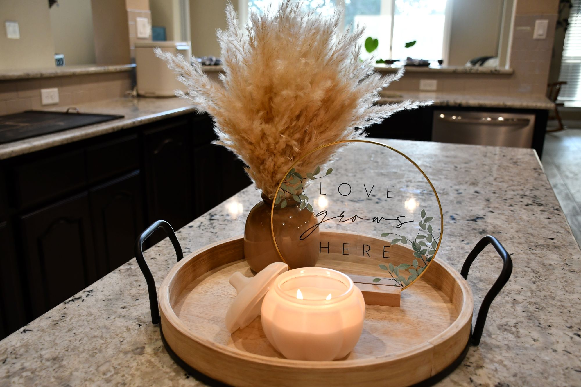 Modern kitchen styling with dark cabinets