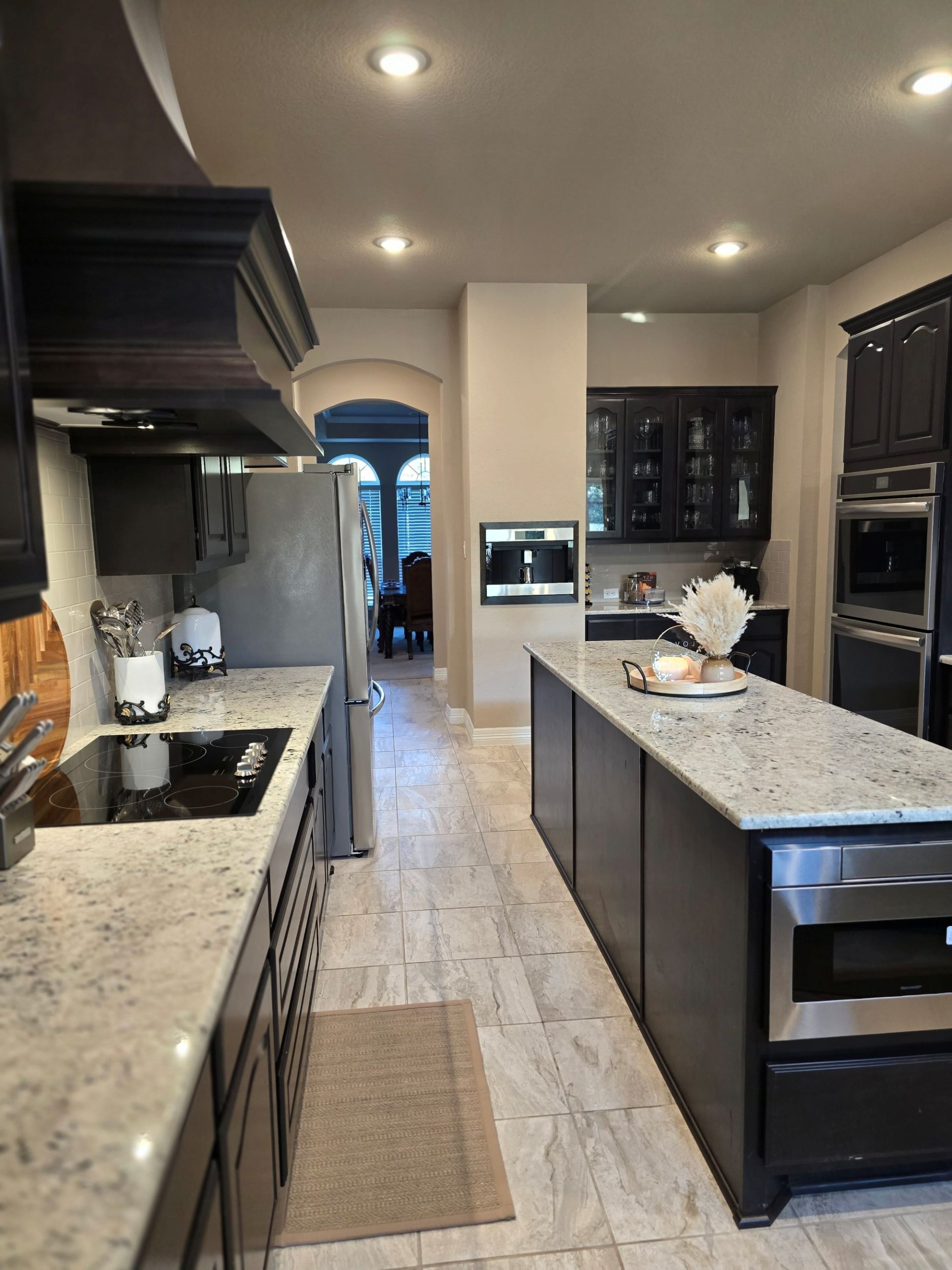 Modern kitchen styling with dark cabinets